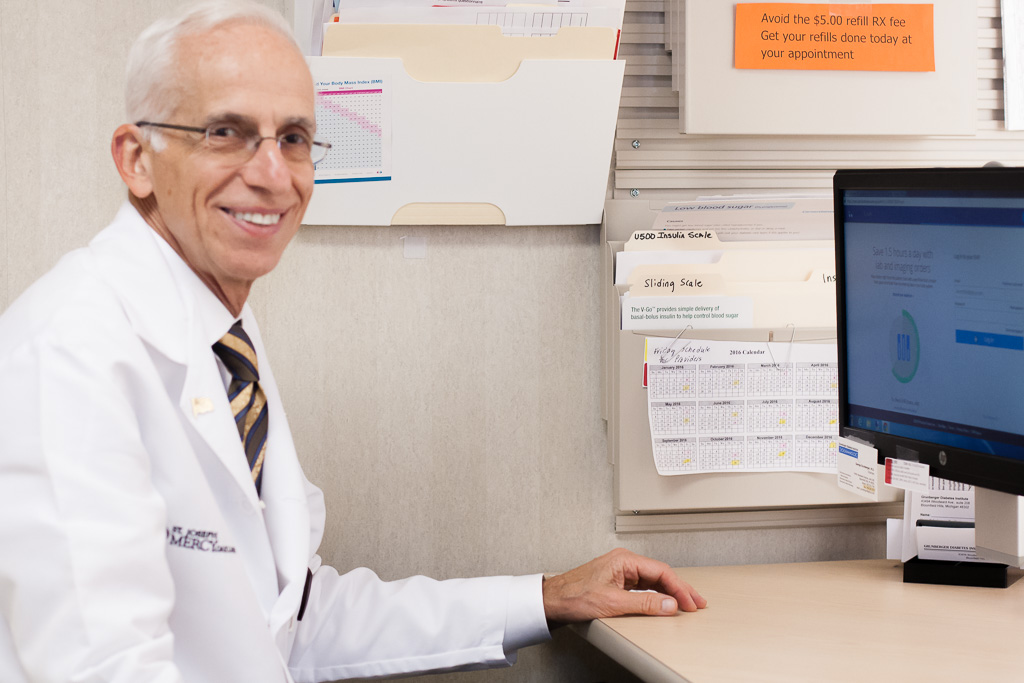 Grunberger smiling at his computer